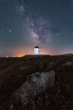 Milky way on old windmill nightscape with stars
