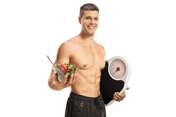 Young topless man holding a salad bowl and a weight scale