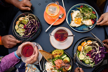 Top view cafe table with bowls of salad