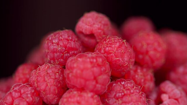 Fresh raspberry fruits as food dackground. Red raspberries, rotation.