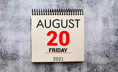 Wall calendar with a red pin - August 20