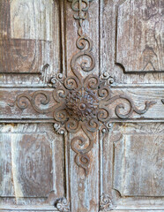 Detail of a beautiful old wooden door of Church Maria Strassengel, a 14th century Gothic pilgrimage church in the town of Judendorf Strassengel near Graz, Styria region, Austria