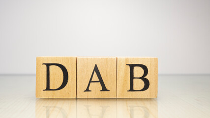 The name Dab was created from wooden letter cubes. Seafood and food.