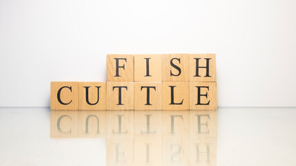 The name Cuttlefish was created from wooden letter cubes. Seafood and food.