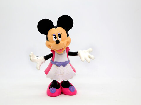 Minnie Mouse without her traditional bow on her head. Toy. Cartoon characters from Walt Disney Pictures Studios. Minnie is Mickey Mouse's girlfriend.  Doll with interchangeable clothes.