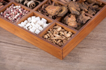 Different kinds of Chinese medicine in wooden medicine box