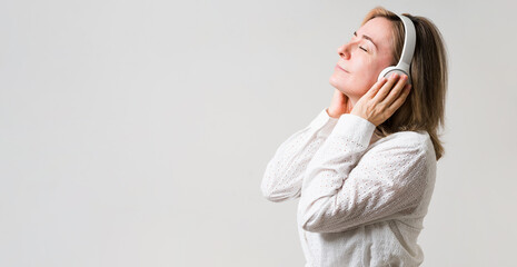 Older woman listening to calm relax music