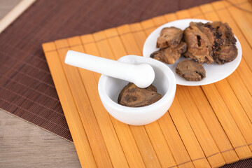 Chinese medicine rhubarb and medicine mortar on bamboo slips