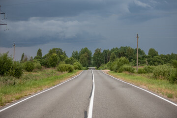 Fototapeta na wymiar a road that goes away in a straight line