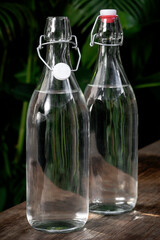 flip top clear water bottle outdoors on garden table - 446351784