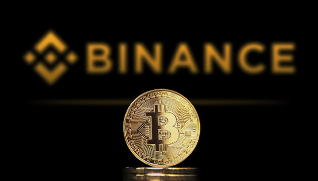 Cali, Colombia - July 20, 2021: Bitcoin BTC representation coin with Binance exchange logo in background. Binance is a cryptocurrency exchange that provides a platform for trading cryptocurrencies.