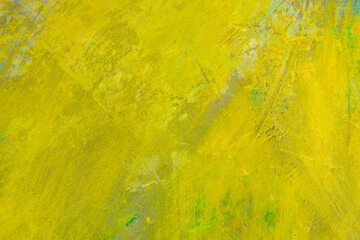 colorful creative motley background: smudged residues of oil paints on a wooden palette, short focus, selective blur