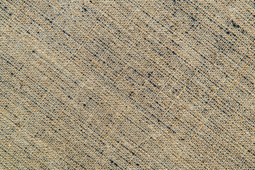 dark creative background: reverse side of black-primed linen canvas, uneven lighting, color toning