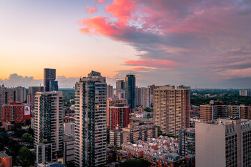 Beautiful colorful sunset Entire futuristic city skyline view of downtown Toronto Canada. Modern buildings, urban architecture, cars travelling. Construction and development in a busy city.