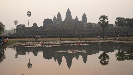 Naklejka premium Ancient Khmer Empire temples in Angkor Wat during sunset.