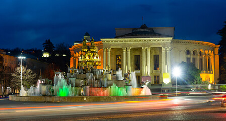 Fototapeta na wymiar Illuminated Colchis Fountain in georgian Kutaisi city at spring evening