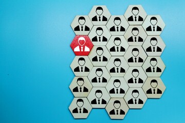 hexagon with one worker and one red worker. business concept