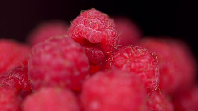 Fresh raspberry fruits as food dackground. Red raspberries, rotation.