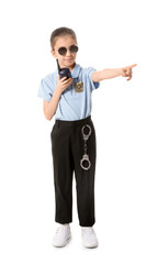 Cute little police officer on white background