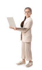 Cute little businesswoman using laptop on white background