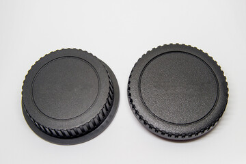 cover for photographic camera body and photographic lens body on a black background.