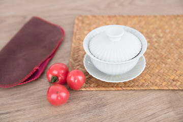 Chinese traditional gaiwan tea and a few cherry tomatoes