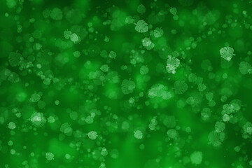 Abstract bokeh design of leaves of different sizes  on agreen background.