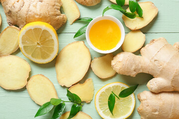 Composition with fresh ginger and lemon color wooden background