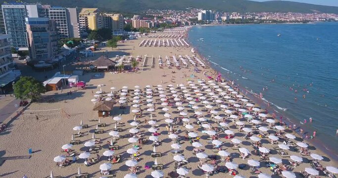 Aerial view of Popular summer resort Sunny Beach, Bulgaria. Blue sea coastline, sandy beach, many beach umbrellas of summer resort.