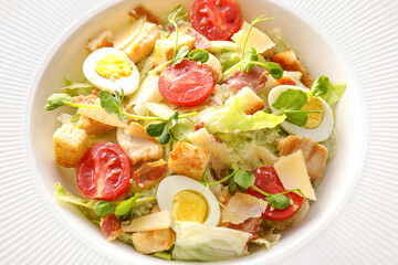 Plate with tasty Caesar salad, closeup