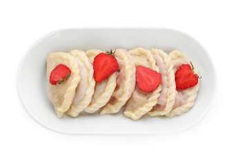 Plate with tasty dumplings and strawberry on white background