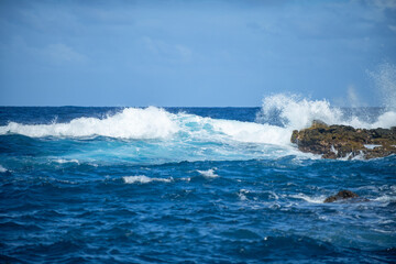 Aerial top view of beautiful sea waves and rocky coast. The concept of calmness on nature.