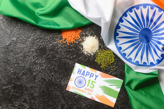 Indian flag and greeting card for Independence Day on dark background