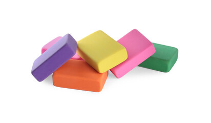 Pile of bright erasers on white background