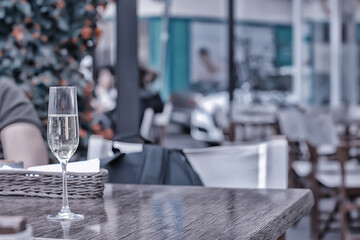 glass white wine restaurant interior, abstract evening dinner with alcohol at the bar