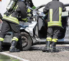 Firefighters with apparatus breathing during the rescue after the crash