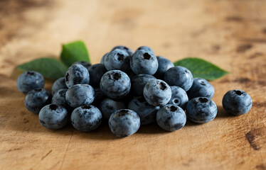 Blueberries on an old wooden table.