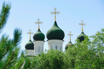 Fototapeta na wymiar Astrakhan, Russia. 07.07.20. View of the church domes with crosses.