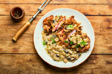 Turkey steak with fried mushrooms