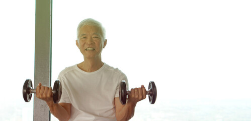 Asian senior elderly man train weight lifting strength to muscle lifestyle after retirement