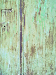 texture old green painted metal plate nailed rusting and crumbling