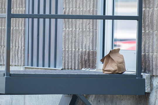 Food Contactless Delivery Left At Office Door In Brown Paper Bag