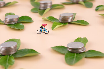 Obraz na płótnie Canvas Riding miniature dolls through the wonderful plant coin scene