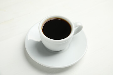 Cup of hot aromatic espresso on white background