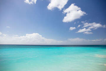 Summer on Barbados Island. Exotic vacations. Palm trees. Turquoise water. Sunny blue sky. Beautiful white-sand beach.