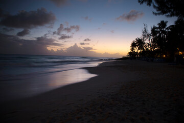 Summer on Barbados Island. Exotic vacations. Palm trees. Turquoise water. Sunny blue sky. Beautiful white-sand beach.