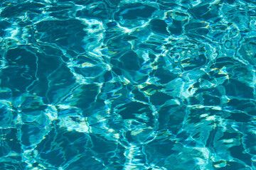 Pool water background, blue wave abstract or rippled water texture background.