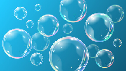 Blue background with realistic bubbles. Rainbow soap bubbles on blue background.