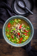 German liver dumpling soup with onion and vegetable