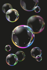 Black background with realistic bubbles. Rainbow soap bubbles on black background.